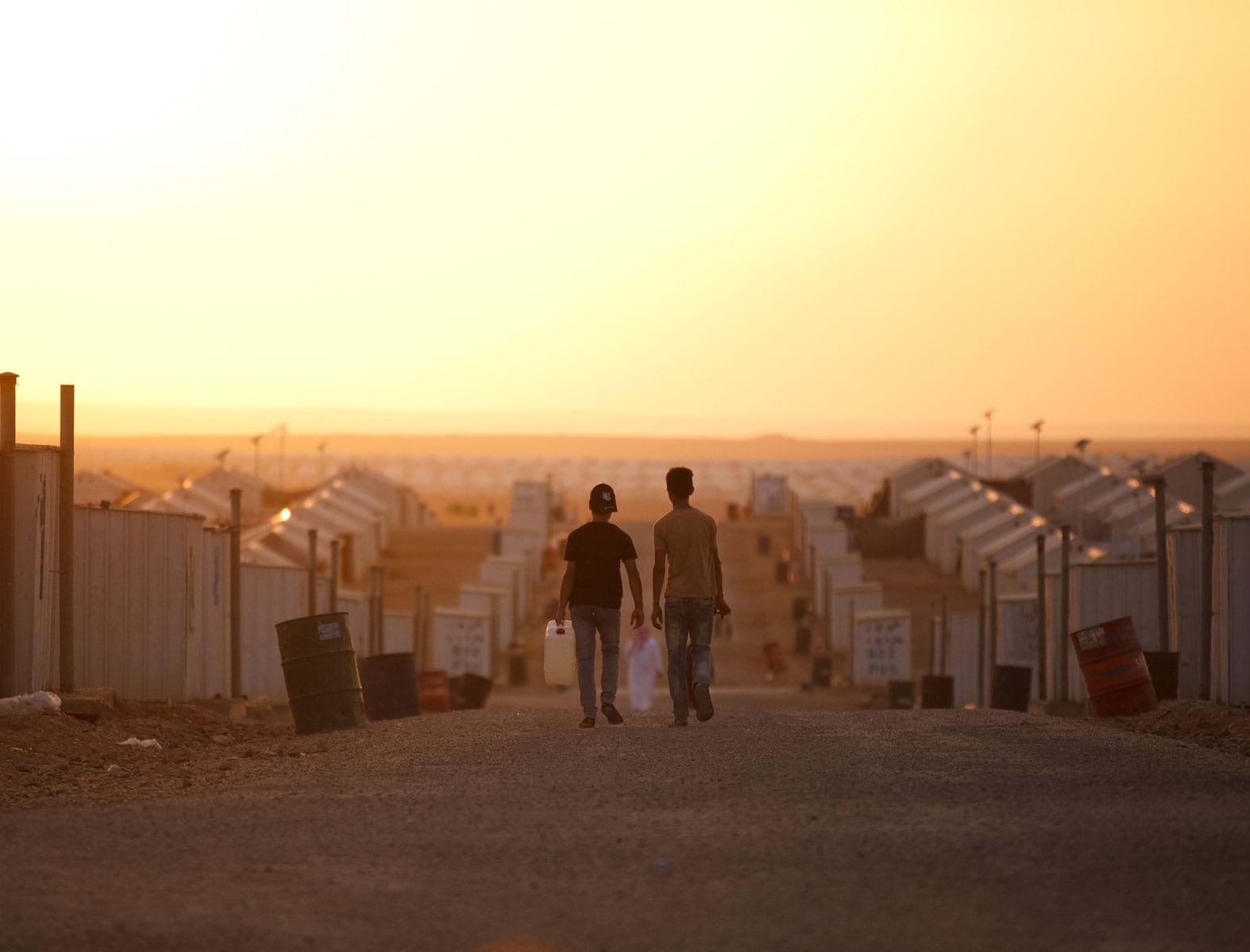 unhcr_footer_hero_two-young-refugee-boys-walking
