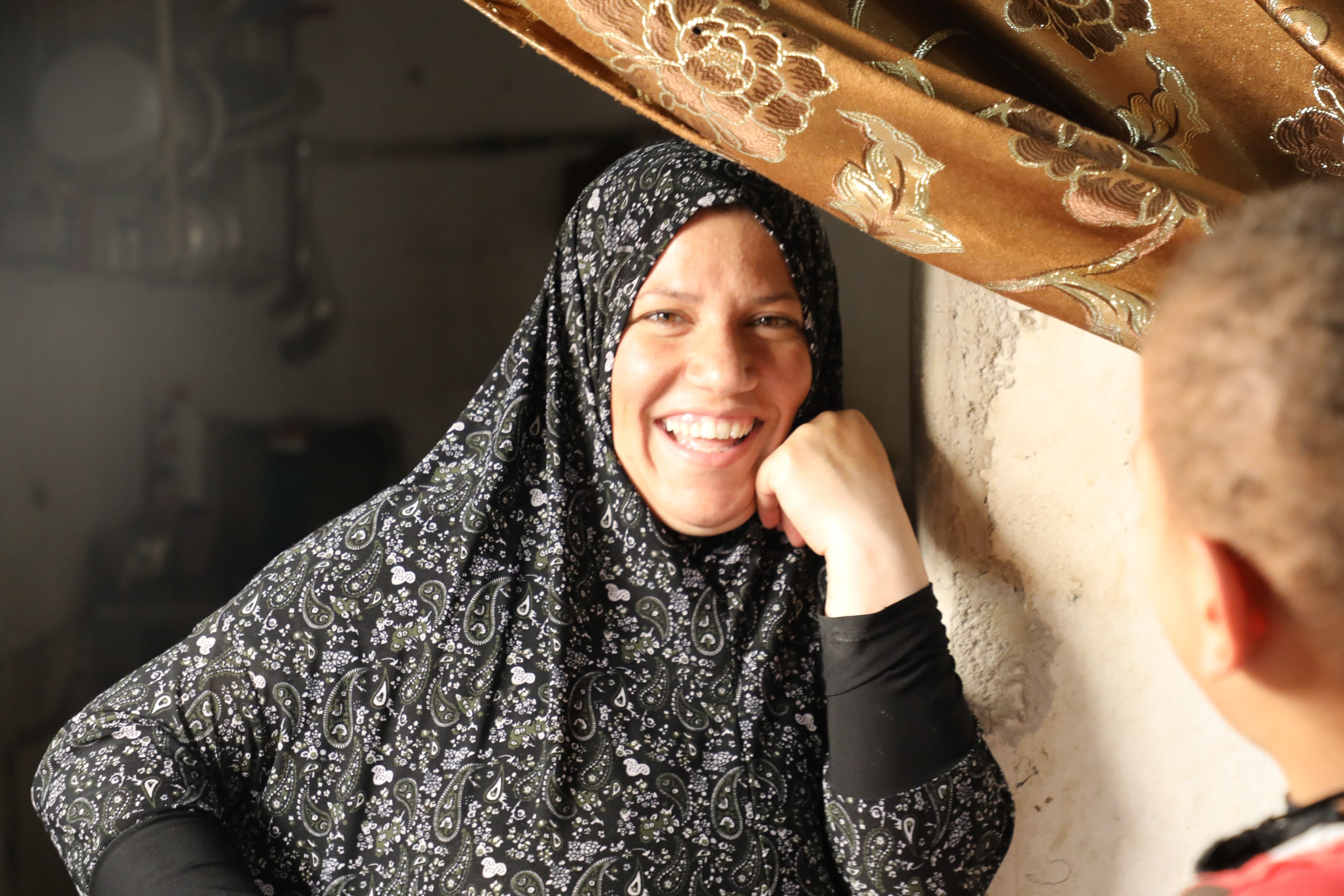 Zahra, a Syrian refugee with five children, is pictured at home in Mafraq.